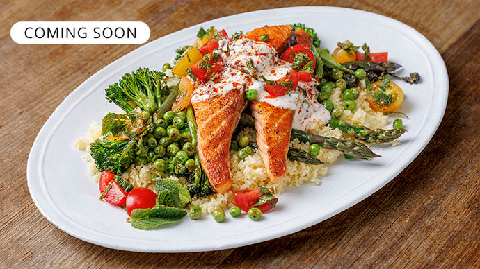 Pan-seared salmon on a bed of couscous and salmon
