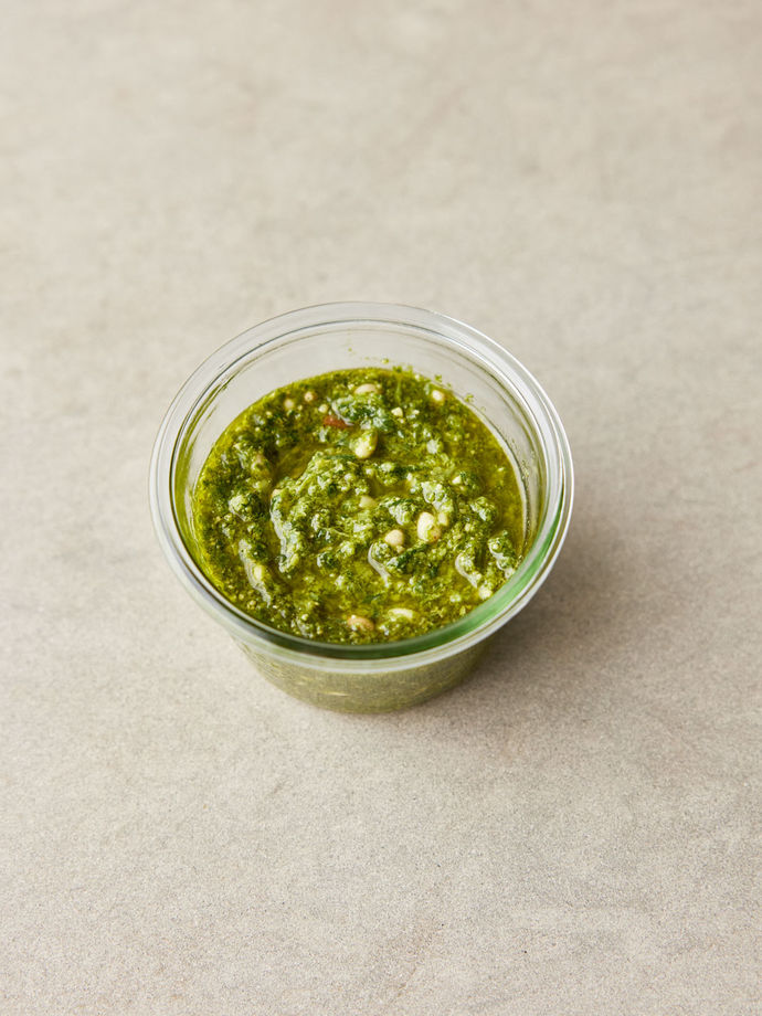 Green pesto in a glass jar